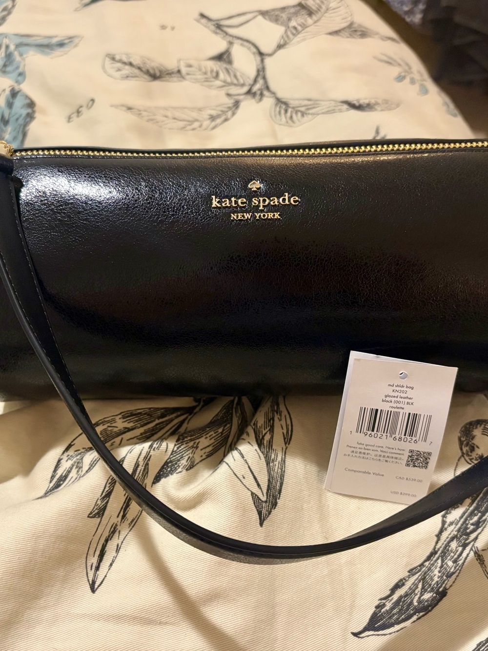NEW Kate Spade Roulette Barrel Shoulder bag in glazed black leather.